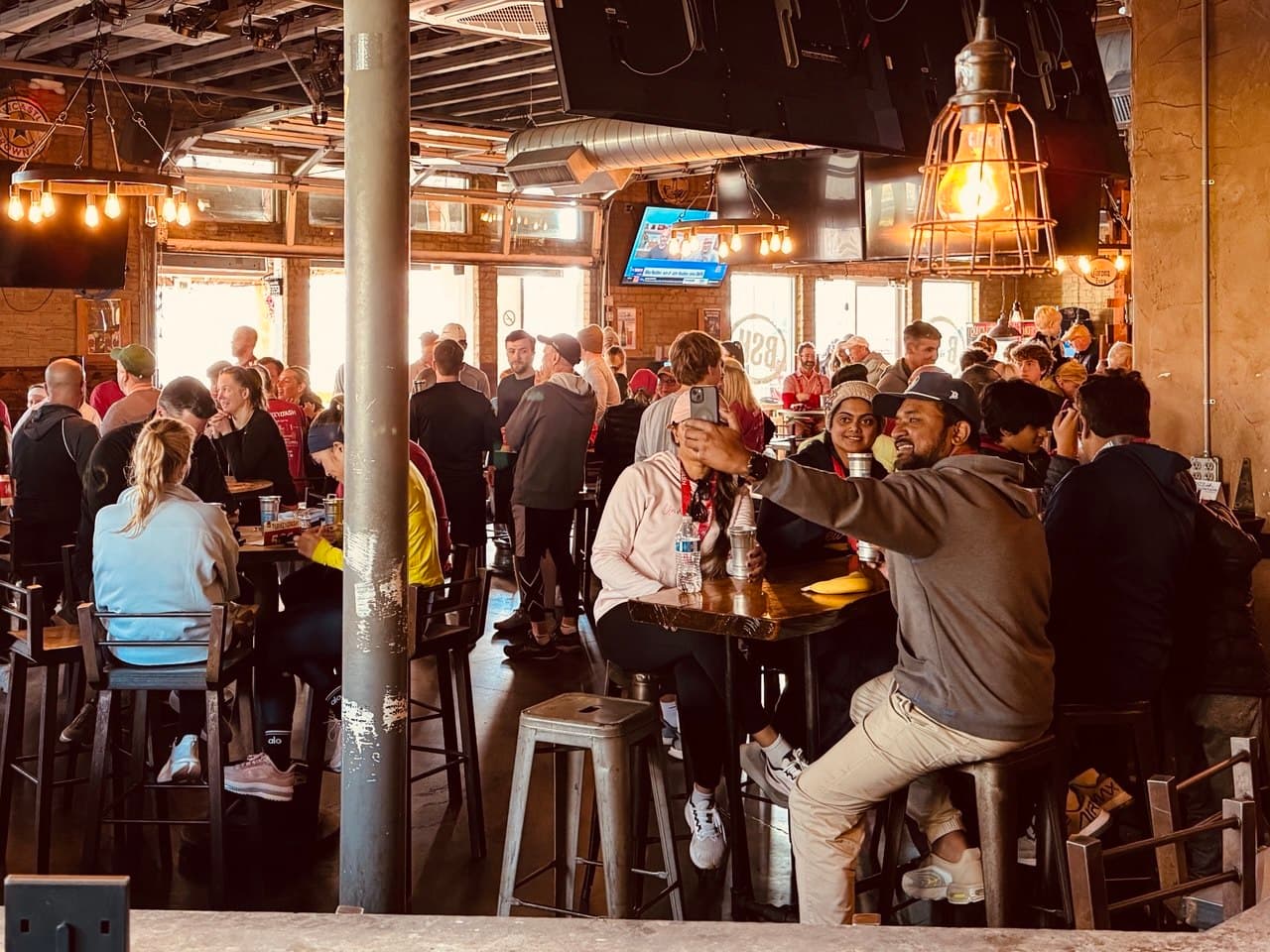 Game day crowd watching the TVs at Bradshaw Social House in Ballantyne